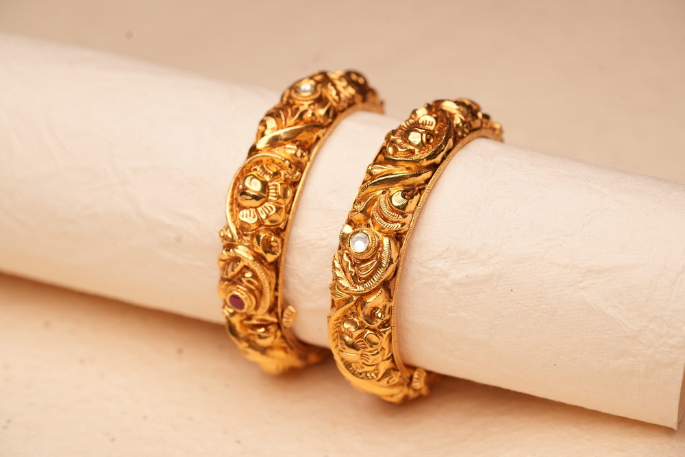 Gold bangle with detailed engraving